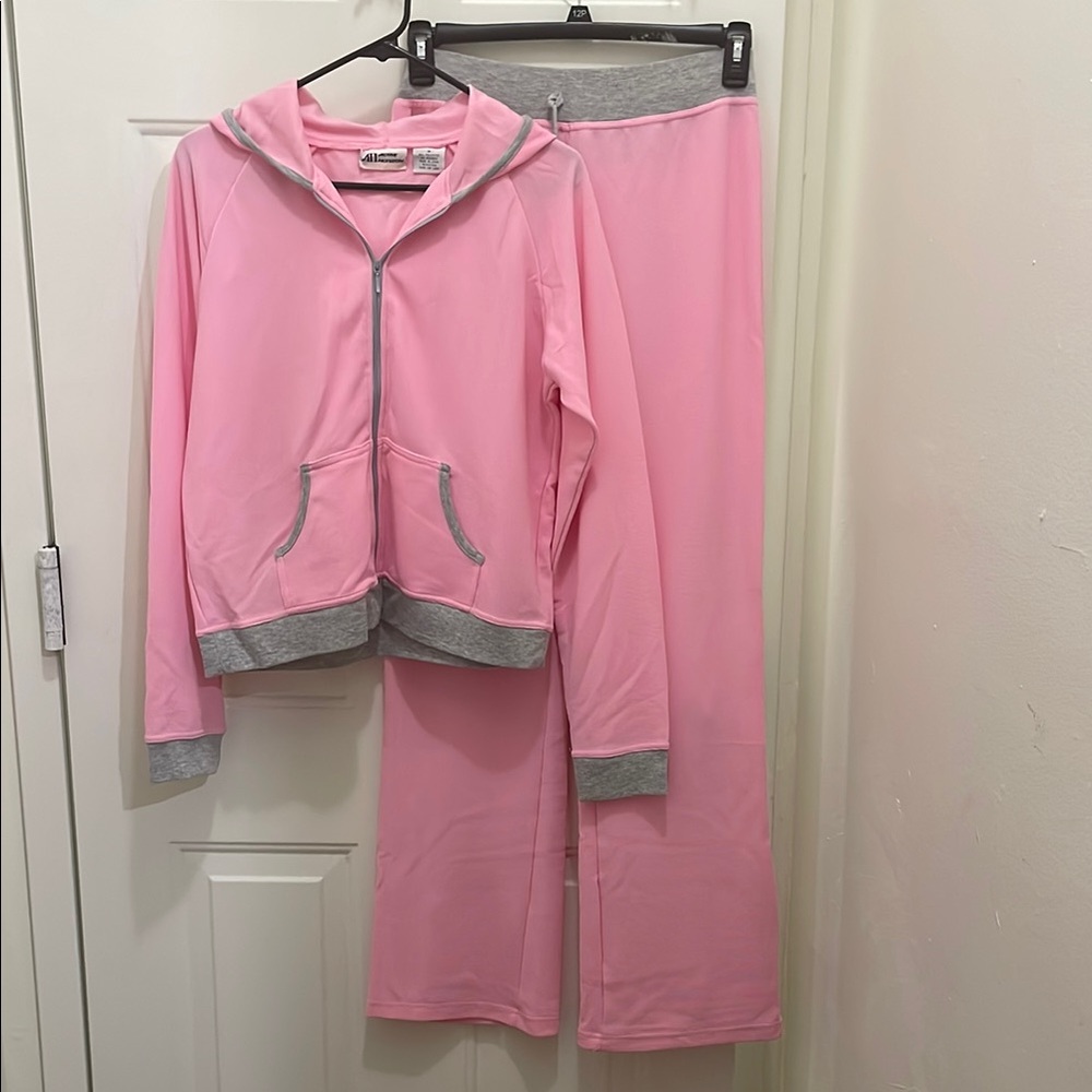Soft Pink and Gray 2-piece track suit;Size M, “Tiny spots on back of legs”